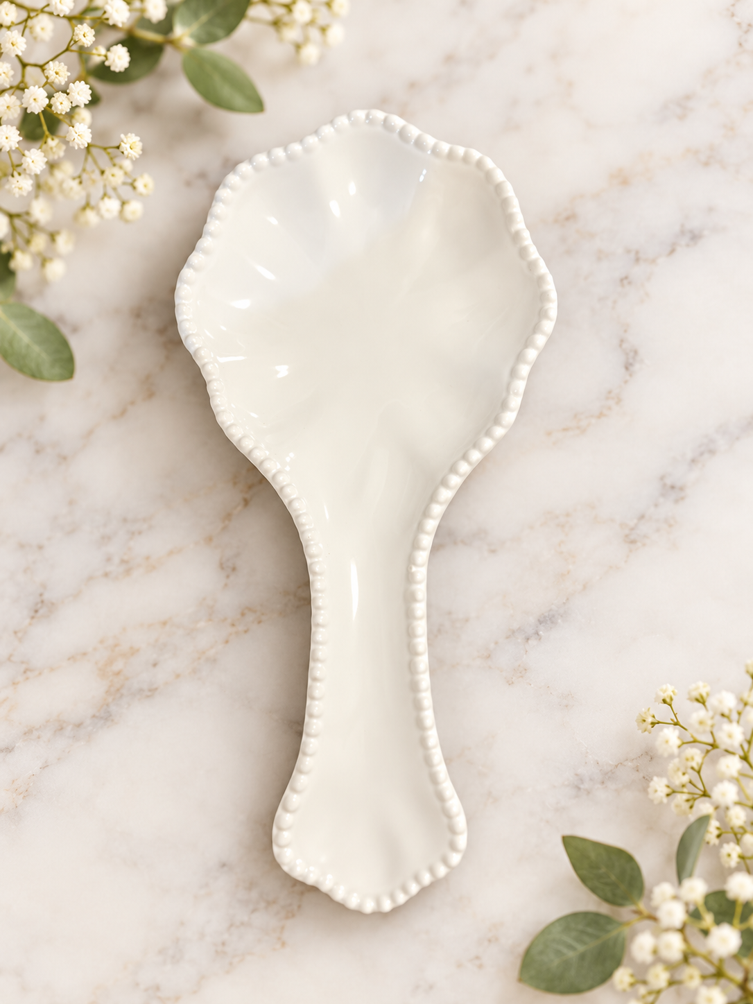 The Beaded Ivory Spoon Rest